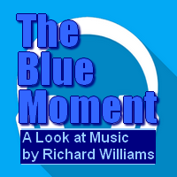 The Blue Moment News Source Thumbs Logo.